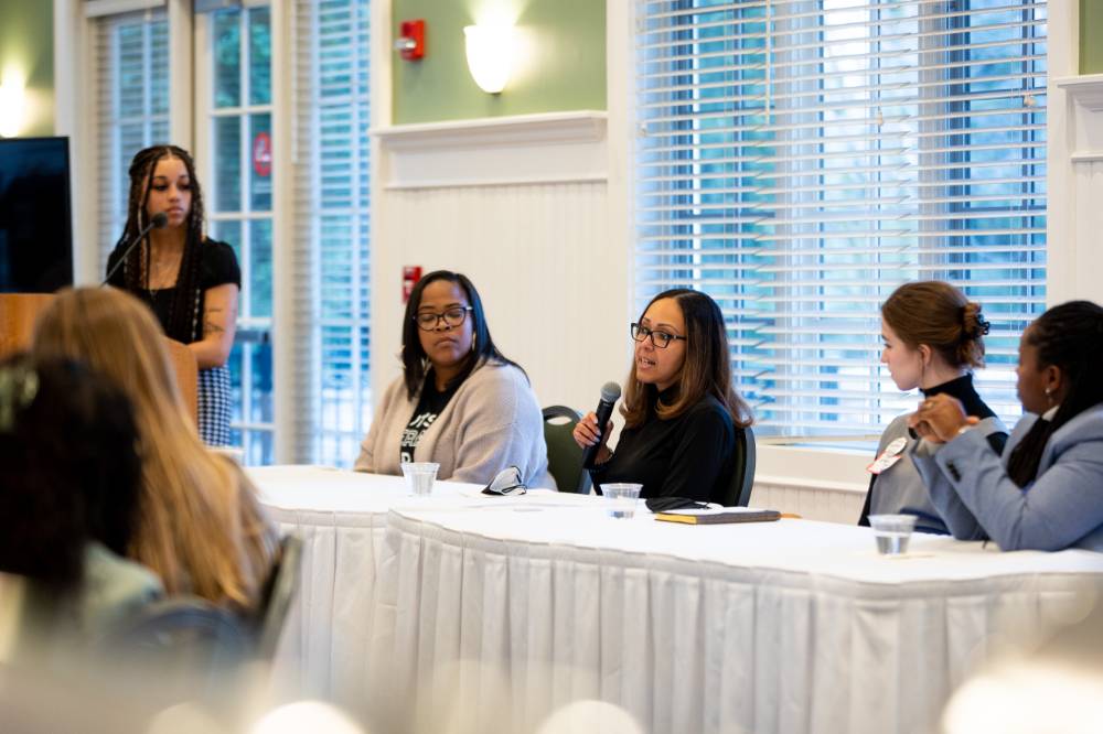 Four panelist engaging with audience